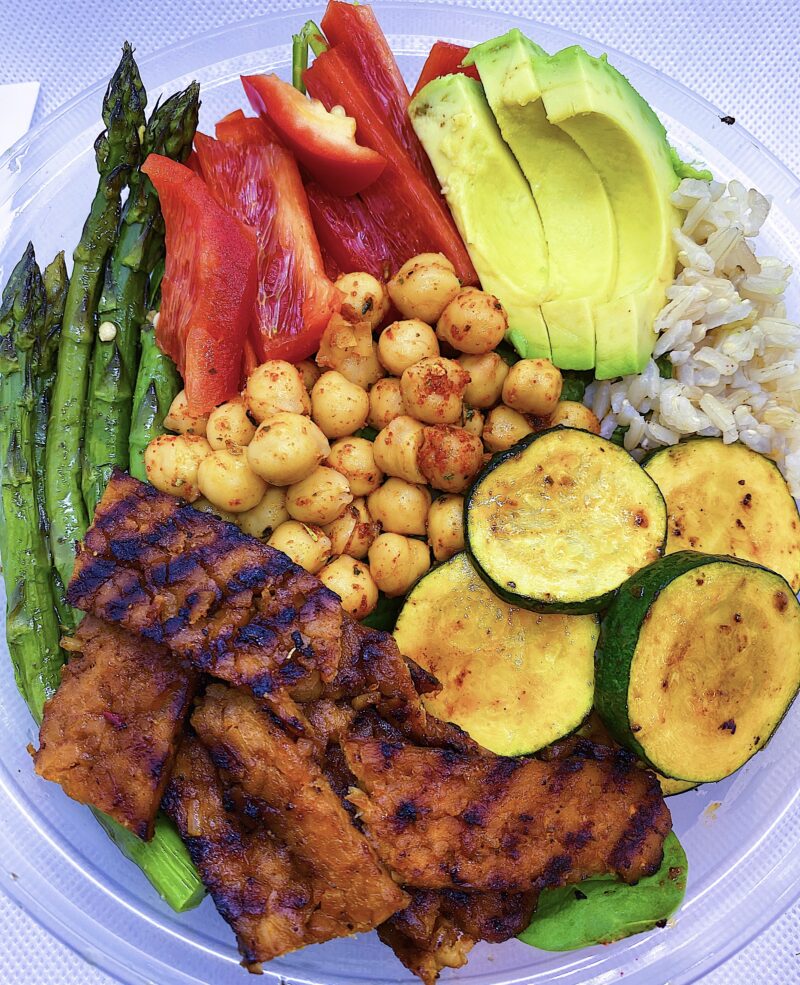 Served with brown rice, asparagus, zucchini, sweet bell peppers, and avocado