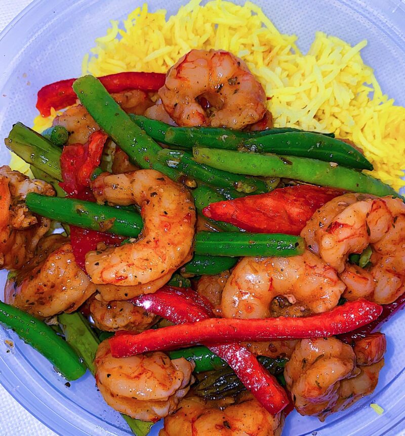 Served with turmeric rice, green beans, and sweet bell peppers