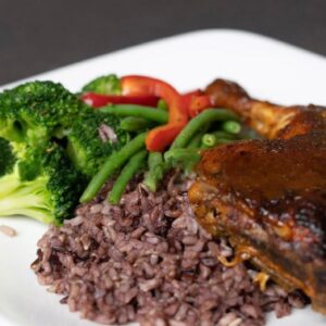 Mediterranean baked quarter chicken served with multigrain rice and mixed vegetables