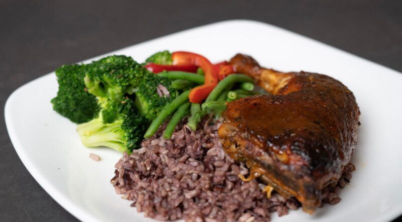 Mediterranean baked quarter chicken served with multigrain rice and mixed vegetables