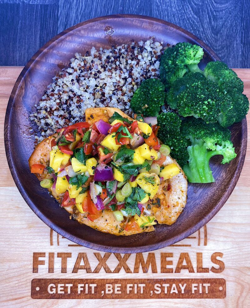 Honey lime chicken served with quinoa, broccoli, and our home-made mango salad