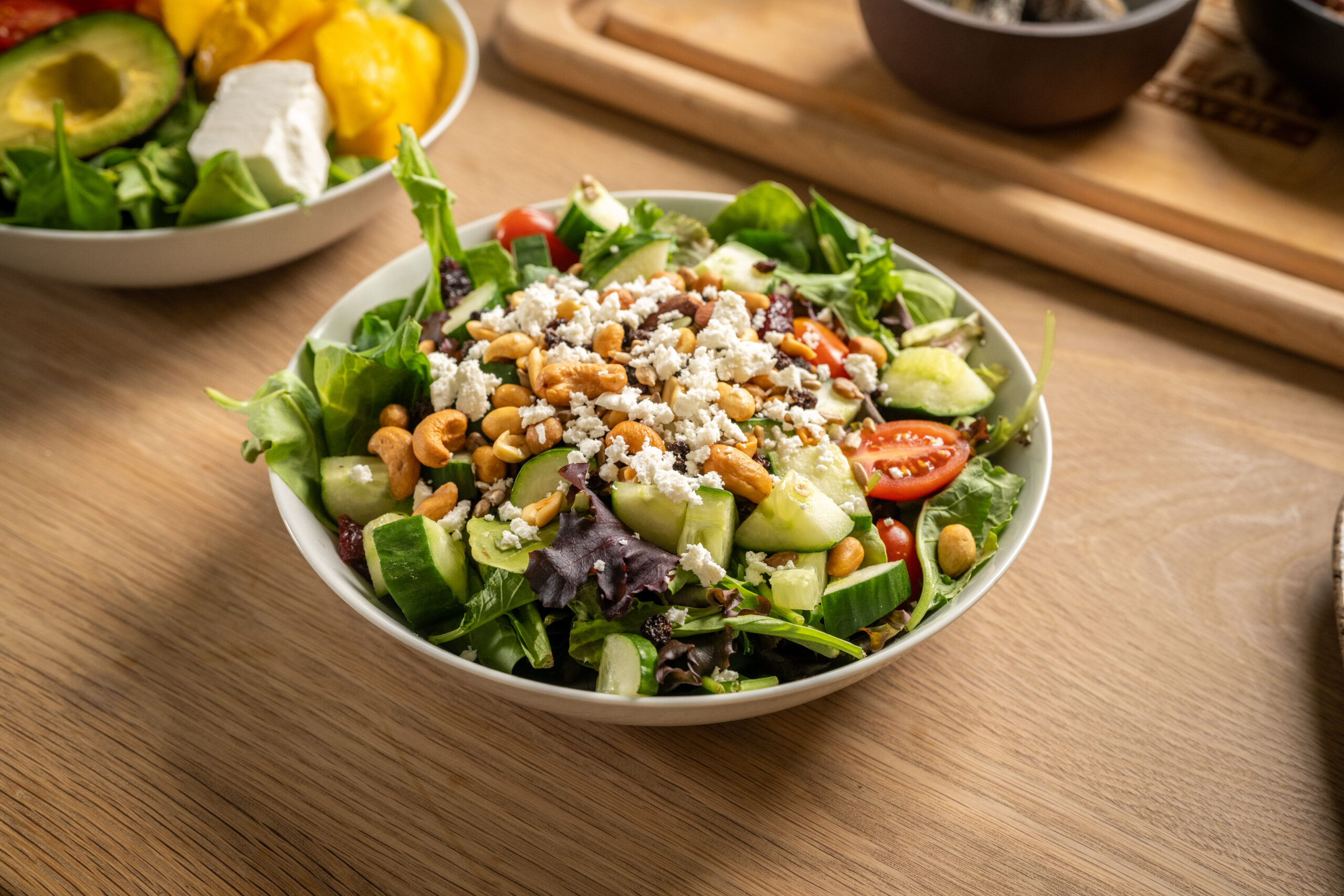 Made with spring mix, tomatoes, cucumbers, red bell peppers, raisins, dried cranberries, sunflower seeds and feta cheese. Served with a side of honey citrus dressing