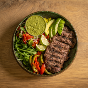 Grilled steak served with turmeric rice, arugula, mixed bell peppers and onions, our pico de gallo salsa, and our house-made chimichurri sauce.